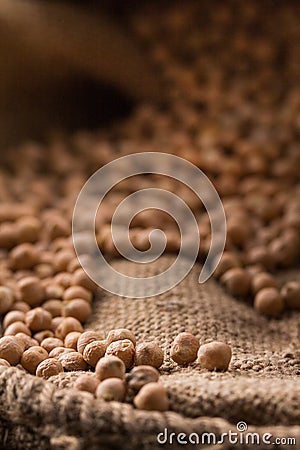 Still life - Placer chickpea in burlap on a wooden background Stock Photo