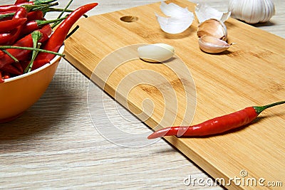 Still life with pods of red chili pepper and cloves of garlic close-up Stock Photo