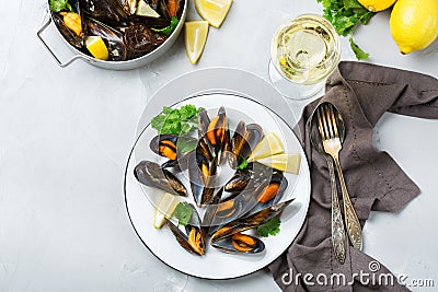 Shellfish mussels with white wine, seafood on a table Stock Photo