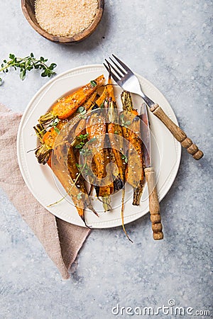 Still life of roasted baby carrots with a herb and honey glaze Stock Photo