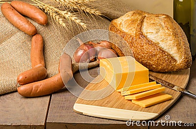 Still life with sausage cheese and bread Stock Photo