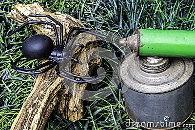 Still life spider on wood with vintage spray can Stock Photo