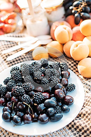 Still life summer picnic blackberry apricot raspberry Stock Photo