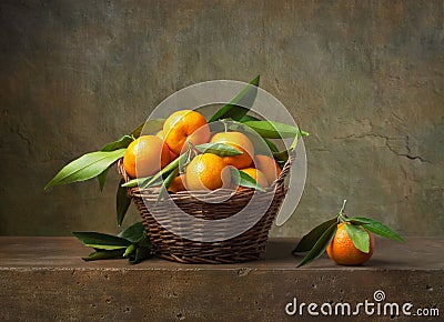 Still life with tangerines in a basket Stock Photo