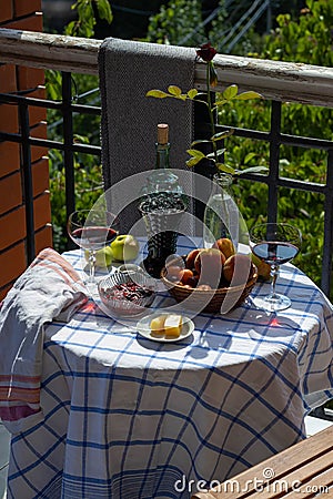 Still life on the veranda a light lunch with wine in the summer afternoon, in the south of Russia. Wine tasting. Stock Photo