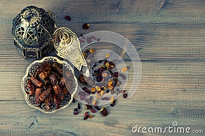 Still life with vintage orintal latern, raisins and dates Stock Photo