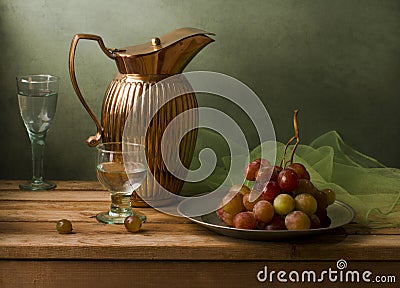 Still life with vintage pitcher and grapes Stock Photo