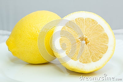 Still life a whole lemon and half of it Stock Photo