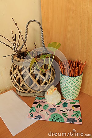 Still life made of common objects - salt sticks in a mug, plys - salt sticks in a mug, plastic card box, pencil and a postcard Stock Photo