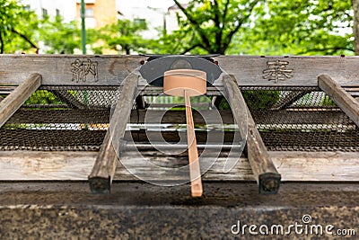 Stillness at the water basin at the entrance of a shrine in Japan for the riual Temizuya purification - 9 Stock Photo