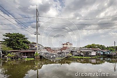 Stilt houses at a klong in Bangkok. Klongs are the canals, that Stock Photo