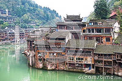 Stilt houses on the Tuojiang River at Fenghuang ancient town, Hunan Province, China Stock Photo