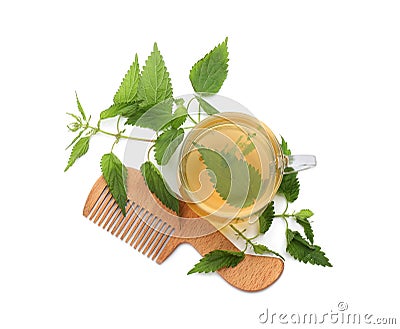 Stinging nettle infusion, green leaves and comb on white background, top view. Natural hair care Stock Photo