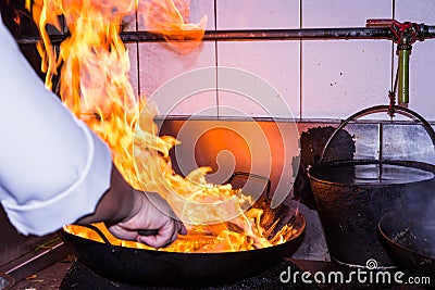 Stir fire cooking Stock Photo