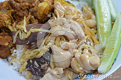 Stir-fried chicken with slice ginger and black mushroom on rice Stock Photo