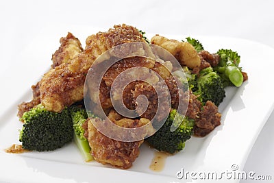 Stir fried crispy fish with broccoli Stock Photo