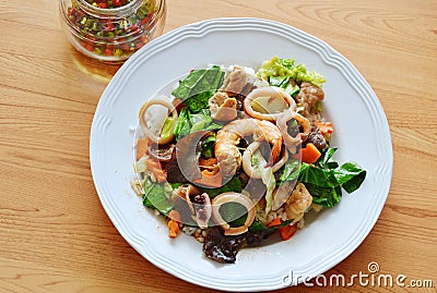 Stir fried mixed vegetable with seafood and chili fish sauce Stock Photo