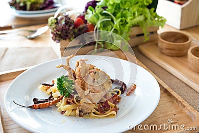 Stir Fried pasta with Dried Chill & Deep fried soft shell crab Stock Photo