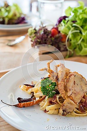 Stir Fried pasta with Dried Chill & Deep fried soft shell crab Stock Photo