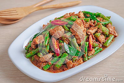 Stir fried pork with yard long bean and red curry paste, Thai food Stock Photo