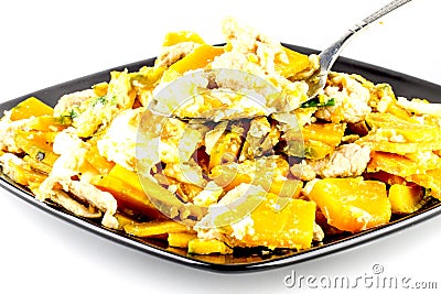 Stir Fried Pumpkin with Egg on white background ,Thai style food,healthy food Stock Photo