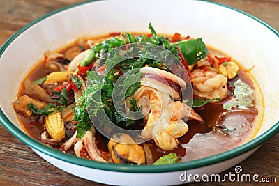 stir-fried seafood (shrimps and squid) with basil leaves, thai street food Stock Photo