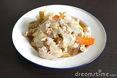 Stir fried slice cabbage and pork with fish sauce Stock Photo