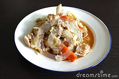 Stir fried slice cabbage and pork with fish sauce Stock Photo