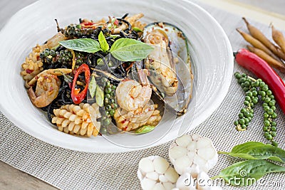 Stir-fried spicy spaghetti black ink with seafoods Stock Photo