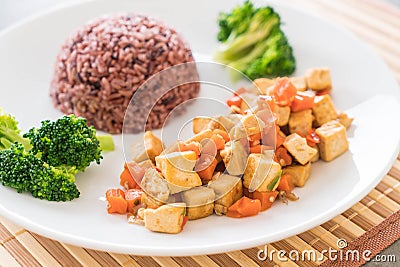 Stir Fried Tofu and Carrot with Berry Rice Stock Photo