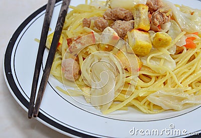 Stir-fried vegetarian noodle topping dice yellow tofu Stock Photo