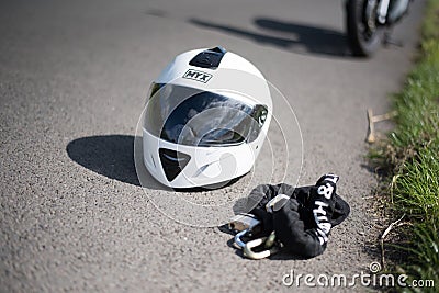 Stirling, Scotland - 15 August 2019: white helmet with motorbike in the background Editorial Stock Photo