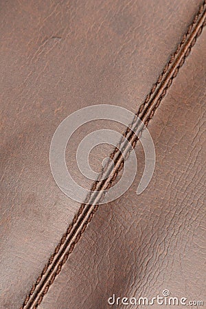 Stitched seam in natural brown and shiny cow leather Stock Photo