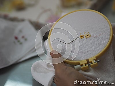 Stitches in hand woman Embroidery Flowers Handmade Art with Simple Stitches Stock Photo