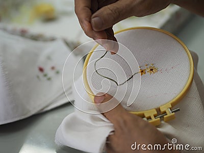 Stitches in hand woman Embroidery Flowers Handmade Art with Simple Stitches Stock Photo