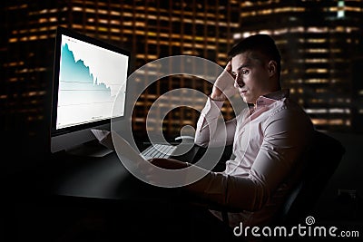 Stock analytic and broker looking at stock charts going down after sales report Stock Photo