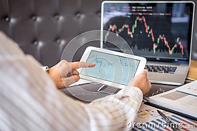 Stock exchange market concept, Business investor trading or stock brokers having a planning and analyzing with display screen and Stock Photo