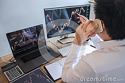Stock exchange market concept, Business investor trading or stock brokers having a planning and analyzing with display screen and Stock Photo