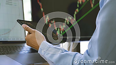 Stock exchange trader working with graphs,diagrams on monitor in modern trading office Stock Photo