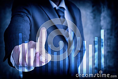 Stock market Businessman in suit point finger touching graph virtual screen, modern business forecasts and competition concept Stock Photo