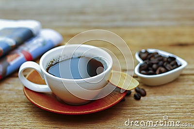 Stock Photo - Coffee, newspapers on wooden table Stock Photo