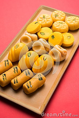 Stock photo of collection of variety of sweets or orange peda or pedha or pera made up of milk, khoya, sugar , saffron etc. select Stock Photo