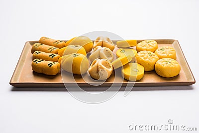 Stock photo of collection of variety of sweets or orange peda or pedha or pera made up of milk, khoya, sugar , saffron etc. select Stock Photo