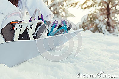 Stock photo of the detail of some boots and snowboard Stock Photo