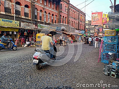 Stock photo of Kolhapur Municipal Corporation building, small commercial shop at the ground Editorial Stock Photo