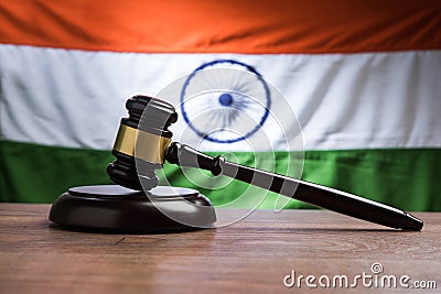 Stock photo showing Indian low and jurisdiction - Indian national flag or tricolour with wooden gavel showing concept of law in In Stock Photo