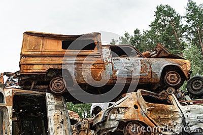 Shot and burned cars during the war in Ukraine Editorial Stock Photo