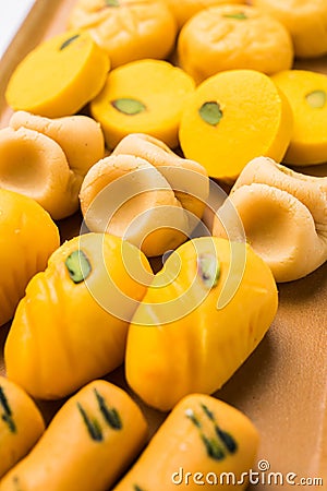 Stock photo of collection of variety of sweets or orange peda or pedha or pera made up of milk, khoya, sugar , saffron etc. select Stock Photo