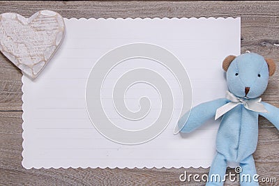 Stock photography flat lay template wooden plank table white letter paper blue bear doll heart craft Stock Photo