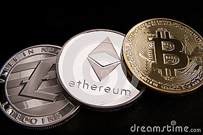 Stock of physical bitcoins, btc, bitcoin, ethereum, litecoins, gold and silver coins, cryptocurrency concept Editorial Stock Photo